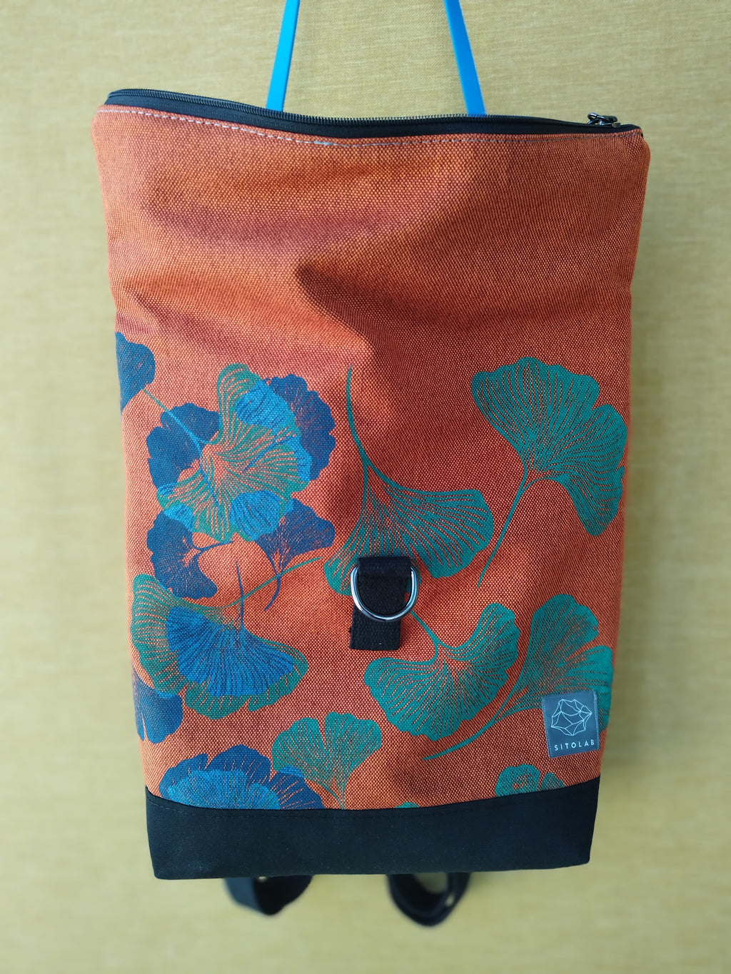 SITOLAB ORANGE GINKO BACKPACK WITH BLUE DETAILS